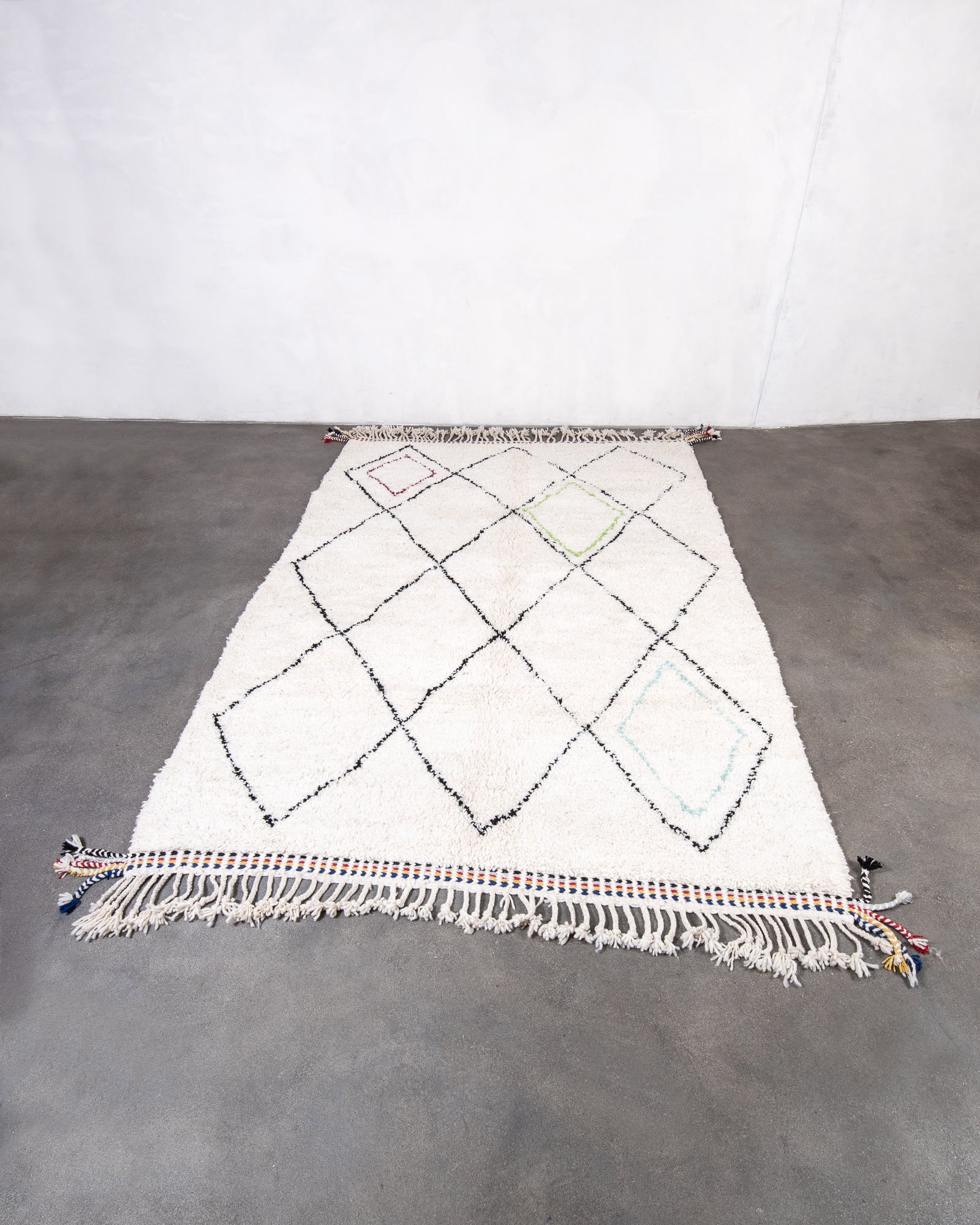 Modern, designer, handcrafted Berber rug from Morocco. Beniourain carpet with beautiful colours and patterns and fluffy wool texture.
